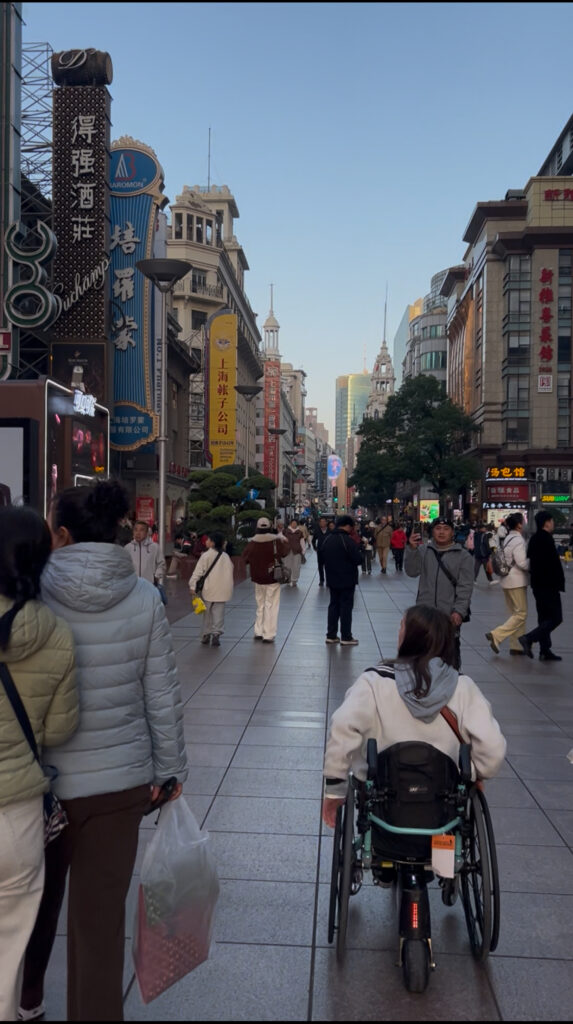 Wheelchair user on Nanjing Rd, Shanghai
