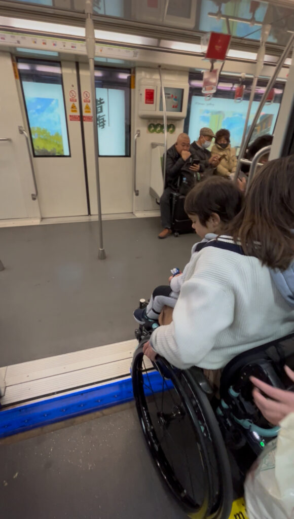 Getting on the Shanghai metro train in a wheelchair