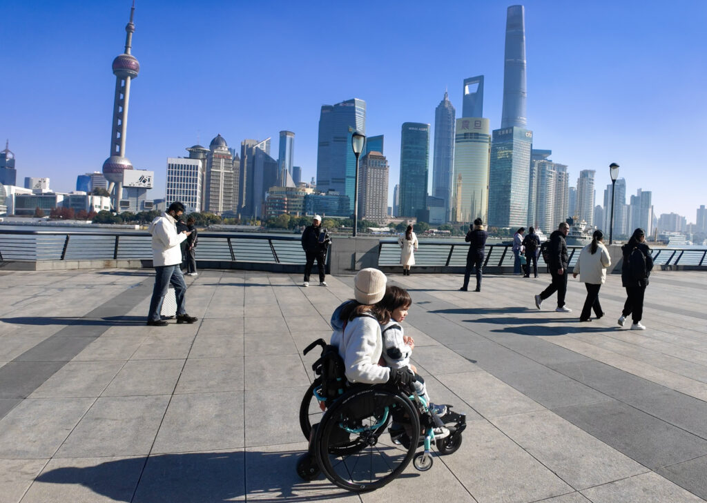 Wheelchair user exploring The Bund, Shanghai